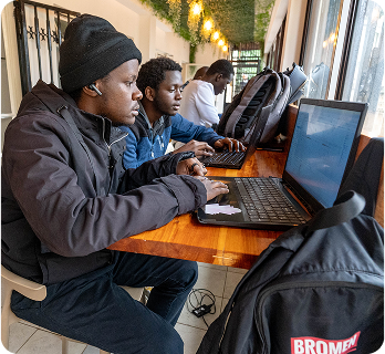 Mentor guiding young leaders in a learning session